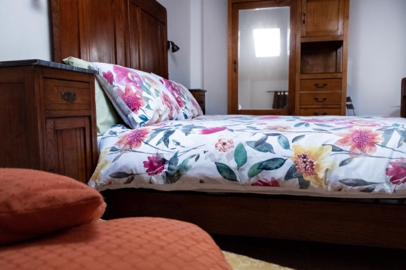 The authentic charm of vintage and antique wooden furniture in the Sunflower Room.